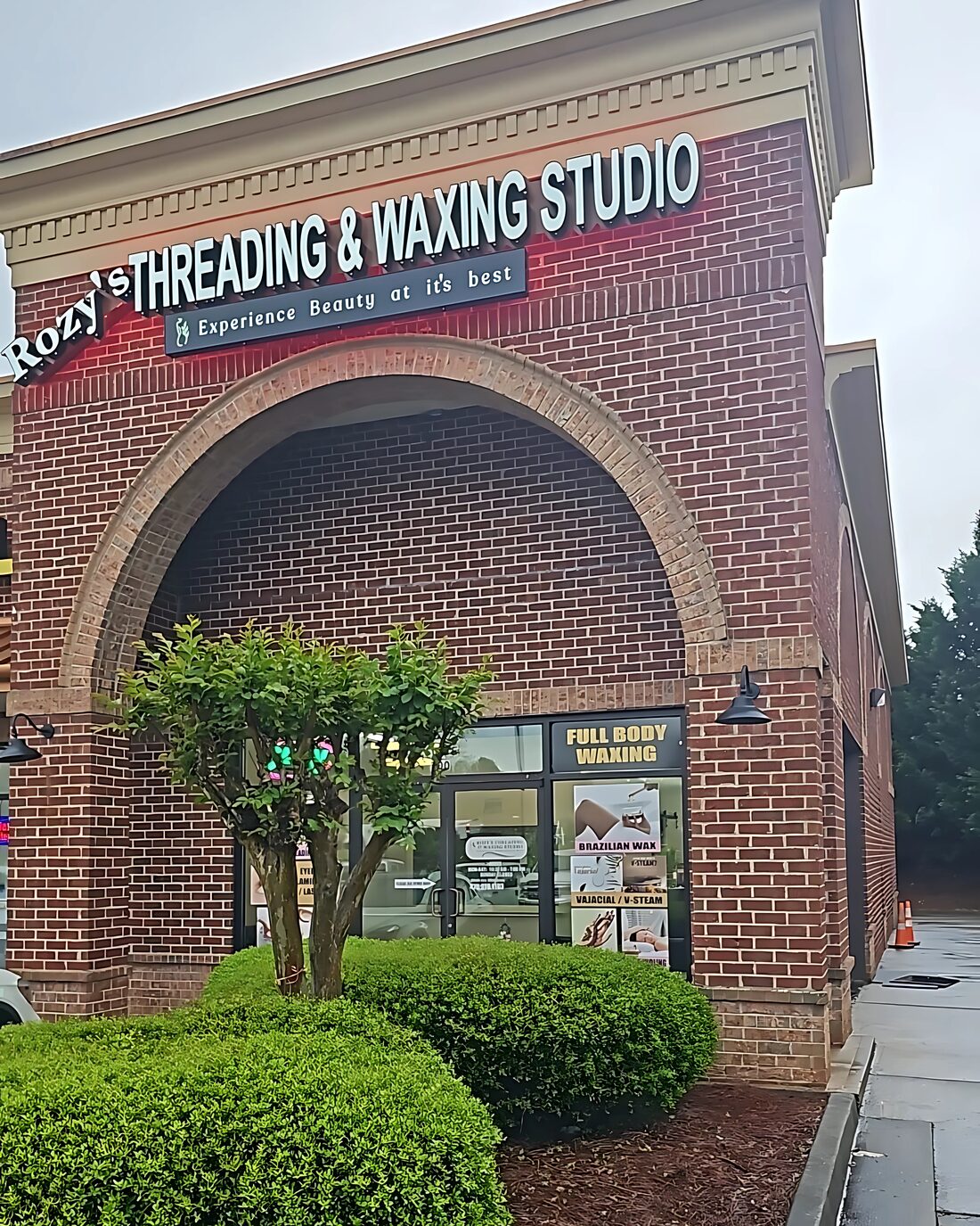 Brick storefront and signage at the studio entrance